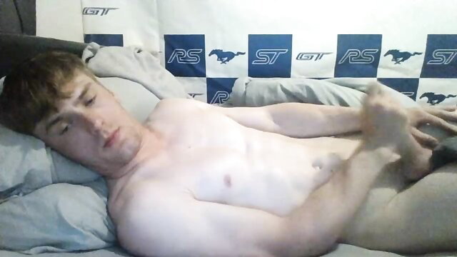 Skinny white twink sleeping nude, short brown hair, toned abs visible