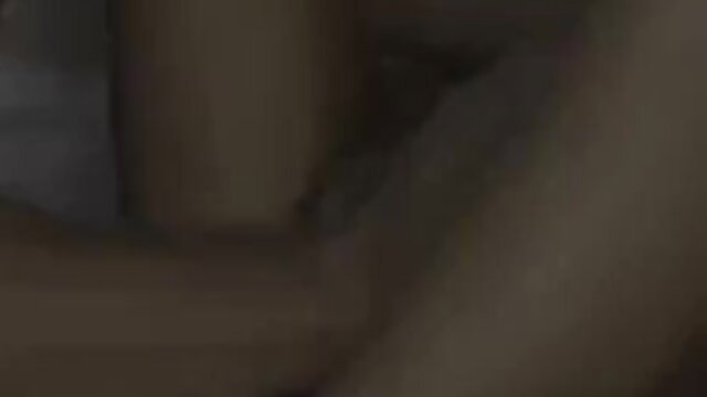 Blurry amateur couple in bed, nude embrace closeup