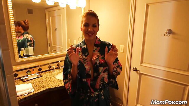 Busty brunette MILF in kimono robe teases in bathroom POV