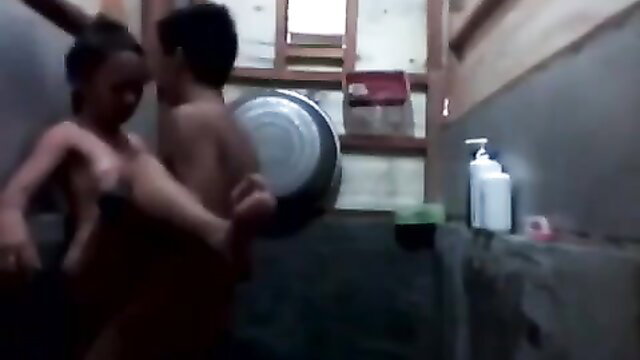 Pinay teen bathroom scandal with nude couple embracing intimately