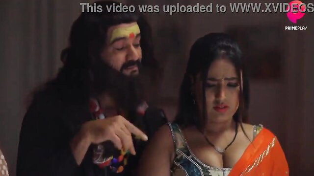 Indian sadhu with long beard gropes busty woman's cleavage in saree