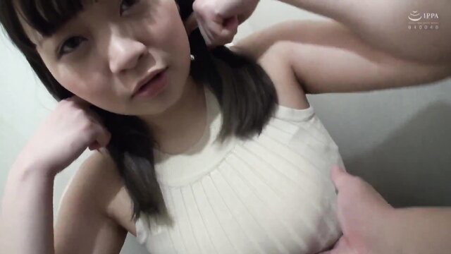 Busty chubby Asian girl flexing arms in tight white top, POV tease