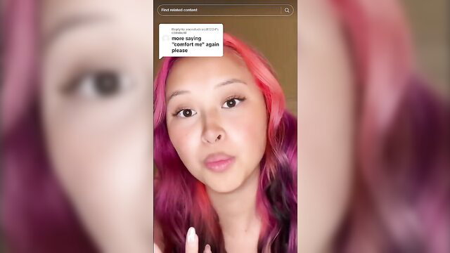 Cute Asian pink-haired girl with big eyes pleading on TikTok