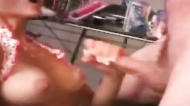 Blonde busty woman smeared in cum holding pink toy closeup