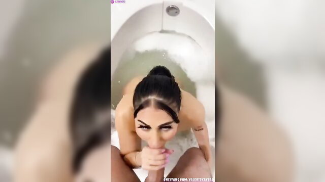 Valerie Kay nude in bubbly bathtub sucking cock closeup