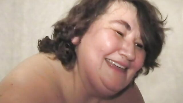 Smiling BBW mature amateur lady with huge ass bares tits