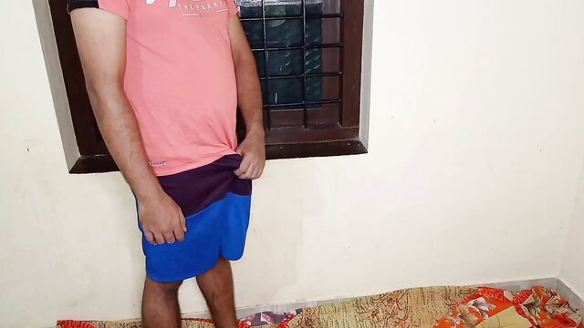 Indian village guy pulling down shorts exposing cock in room