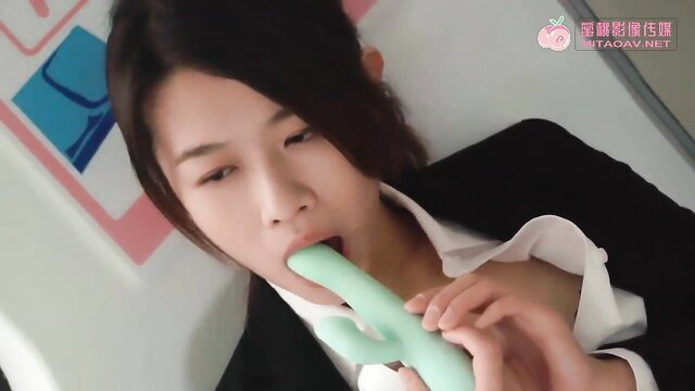 Japanese amateur teen in suit sucking green vibrator closeup