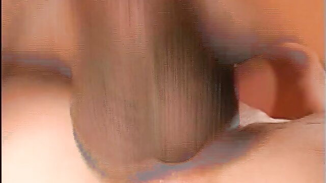 Blonde woman performing oral sex on two men