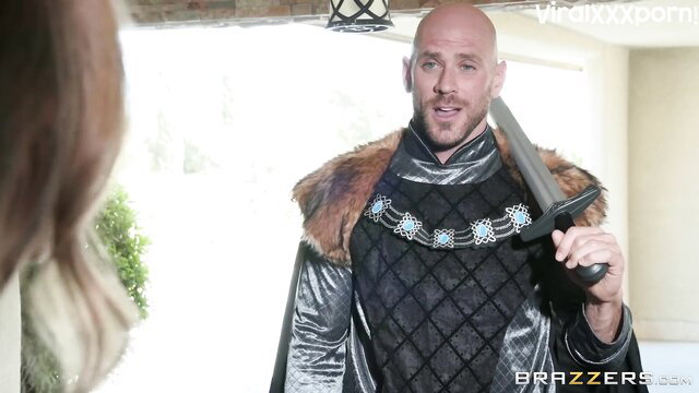 Britney Amber with bald knight in sexy medieval costume holding sword