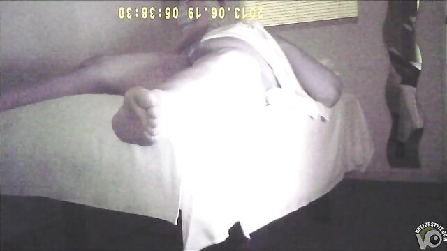 Blonde woman giving handjob in massage parlor, feet visible