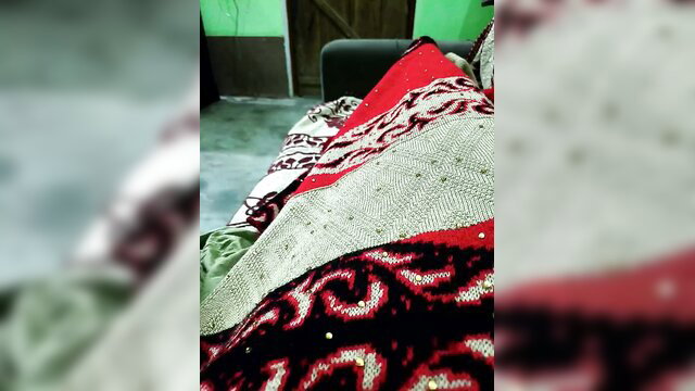 Hot__nenchi under colorful knitted blanket in cozy room