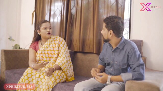 Indian bhabhi in yellow saree chats intimately with desi guy on couch