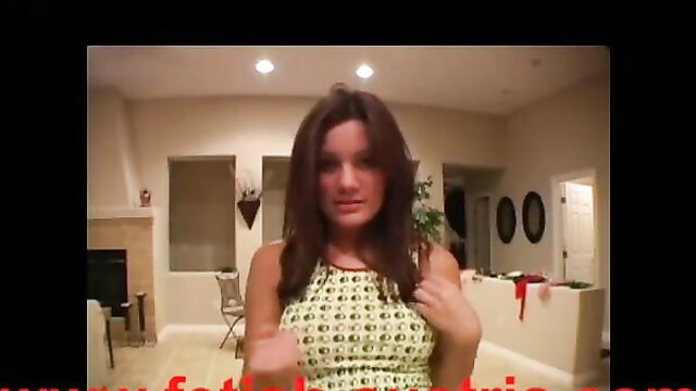 Brunette femdom in green dress teases POV closeup