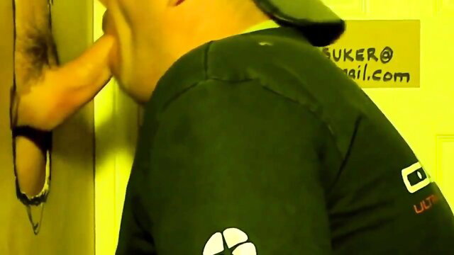 Glory hole handjob blowjob with man sucking huge cock through wall