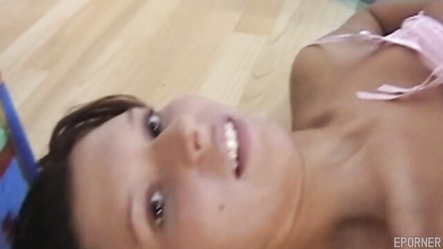 Sultry brunette teen in pink lingerie smiles playfully on floor