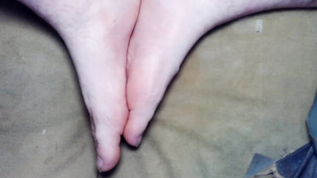 Amateur girl showing off bare pale soles and feet soles closeup