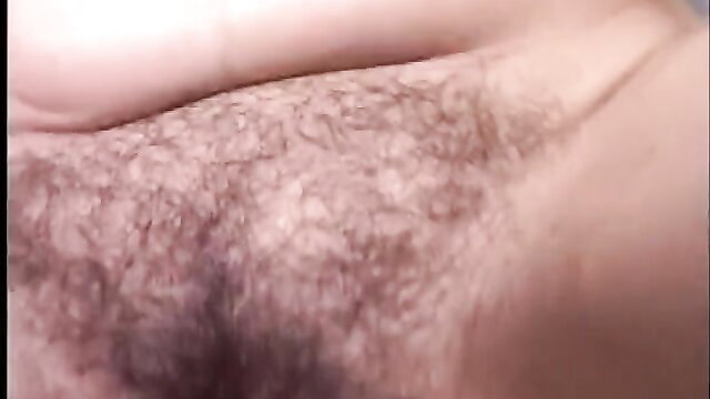 Closeup of hairy male pubic area and erect penis in adult video thumbnail