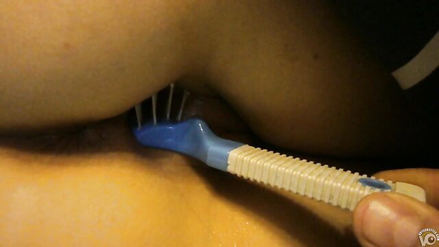 GF's pussy pounded hard by blue hairbrush handle closeup