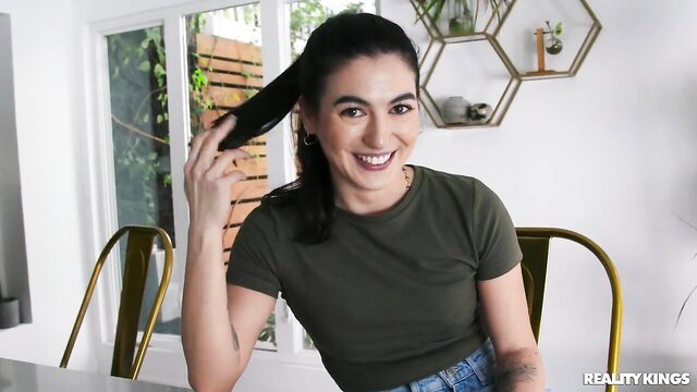 Megan Mistakes smiling in green top, ponytail, Reality Kings bathroom remodel