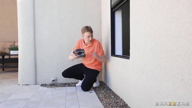 Jimmy Michaels kneels filming Gem Jewels outdoor in Brazzers peeping scene