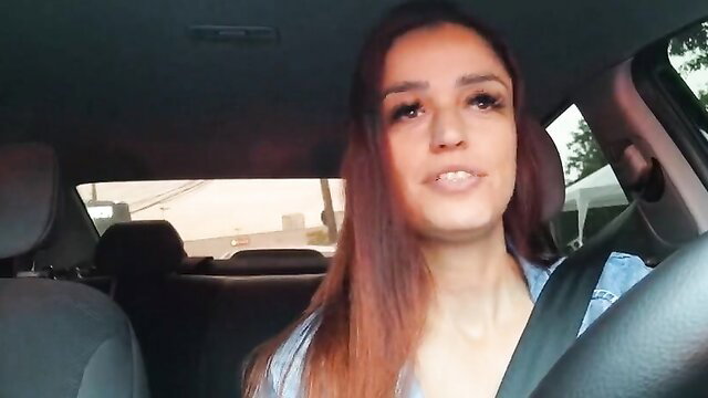 Slutty Latina driver with red hair smiling in car, adult video thumbnail