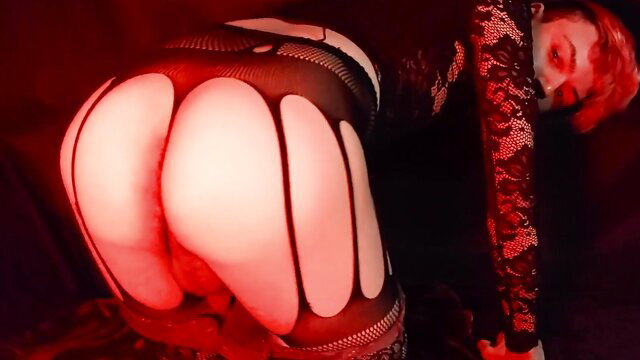 Pale faggot in fishnet lingerie bends over, showing big pale ass