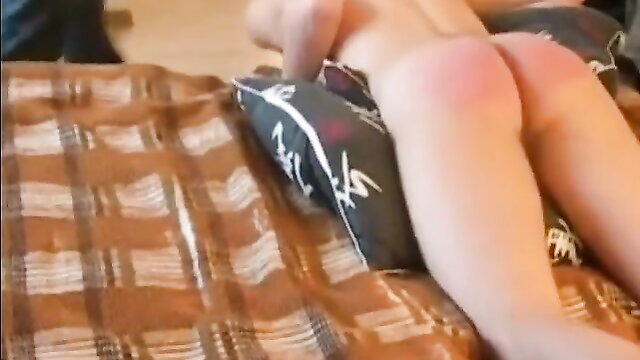 Nude Asian woman bent over bed, red spanked ass in Slave Boy Spanked 5