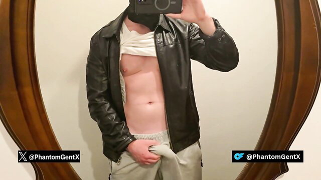 PhantomGentX in dark leather jacket flashes muscled abs and bulging cock