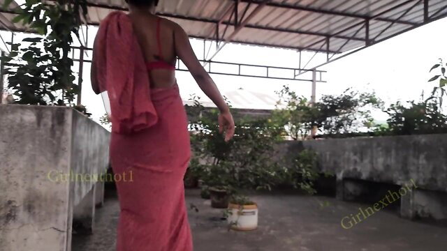 Bengali bhabi in sheer red saree and bra, sexy back view on rooftop