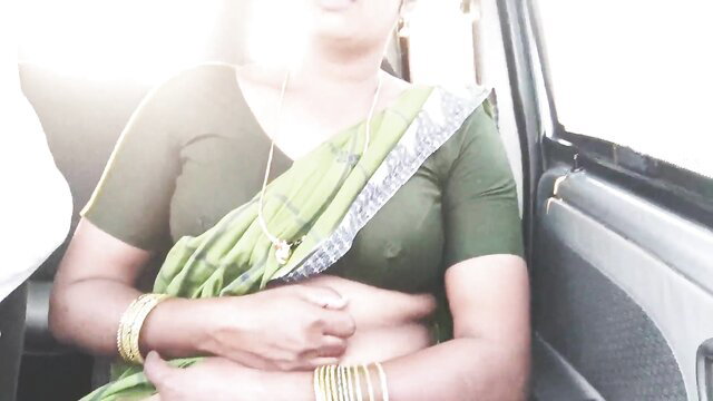 Hot Indian woman in sheer green saree and deep green blouse exposing midriff in car