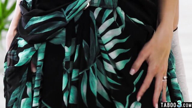 Petite Asian mom in sheer green leaf sarong exposing pussy closeup