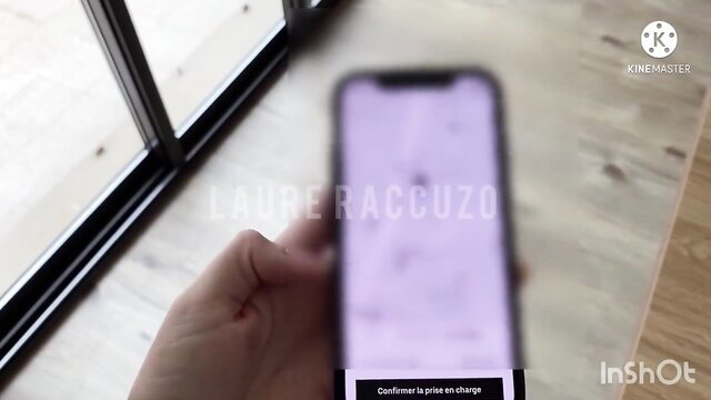 Laure Raccuzo holds phone showing 'Confirm ride in charge' in Uber app