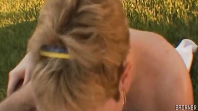 Short-haired blonde MILF nude on grass showing off skills