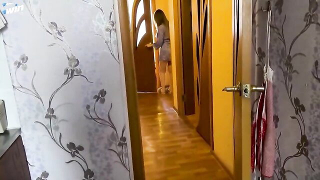 Russian MILF in short dress bending over in hallway tease
