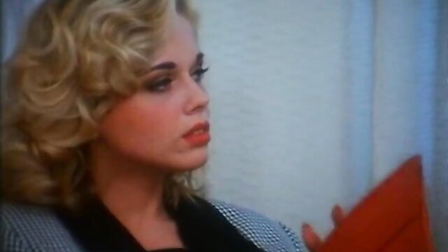 Gorgeous blonde Kelly Trump in sexy checkered top, seductive gaze