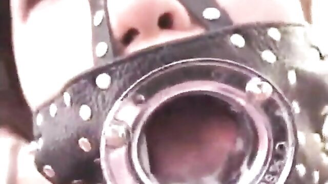 Young Asian girl in BDSM gag mask, open mouth deepthroat ready