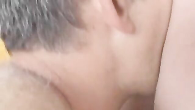Closeup of older man's neck and gray hair in taboo dad-daughter fuck video