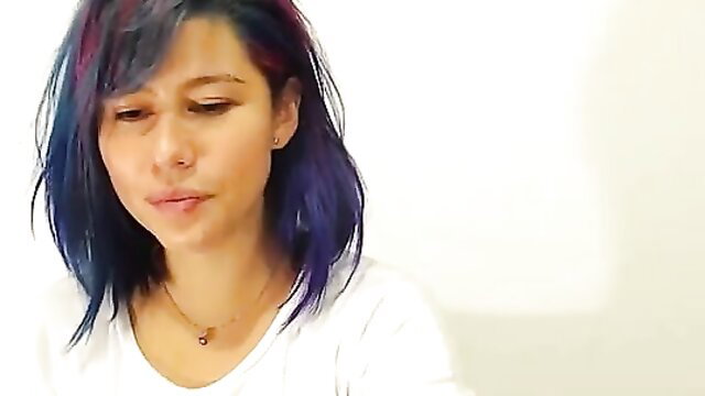 Purple haired Asian beauty with wet look in white top closeup