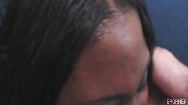 Closeup of black BBW woman's face with hand on cheek in Big Bad Mamoo sex video