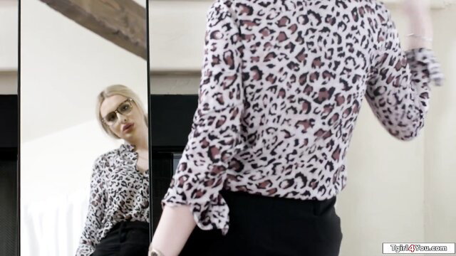 Blonde tgirl in leopard blouse poses sexy, hard cock tease