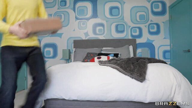 Amber Alena in yellow top with big tits in bedroom scene