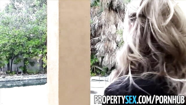 Pristine Edge blonde realtor in black dress at sunny house viewing