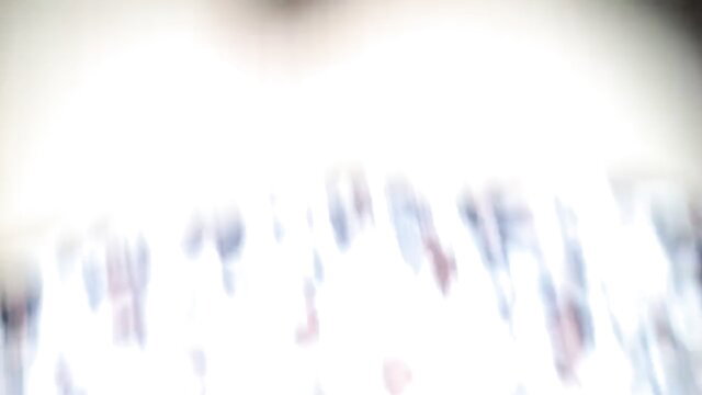 Blurry crowd in white light, abstract adult thumbnail for anal prep scene