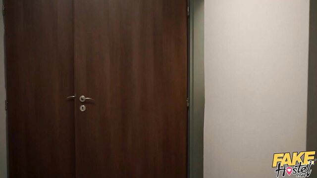 Zaawaadi at fake hostel door with Steve Q landlord