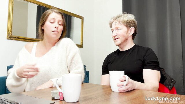 Lady Lyne milf chats with man over tea, big tits in sweater