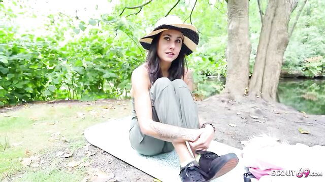 Jenny Stella in sun hat on picnic blanket outdoors, German Scout casting tease