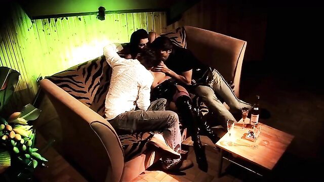 Threesome with brunette in leather boots on zebra couch