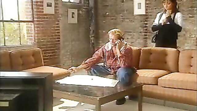 90s retro blonde couple on couch, guy on phone towel