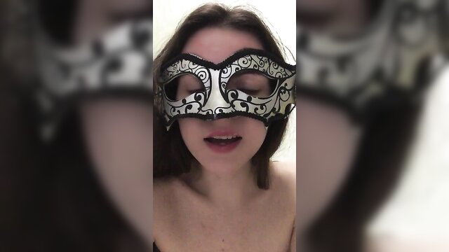 JuliettaV in lace mask, topless closeup, femdom pee tease
